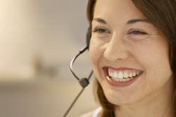 photo of woman smiling with headset