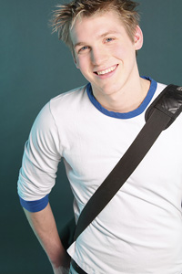 photo of young man with bag